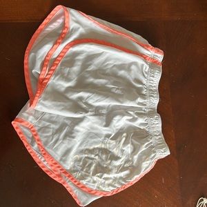 Neon pink and white Nike shorts